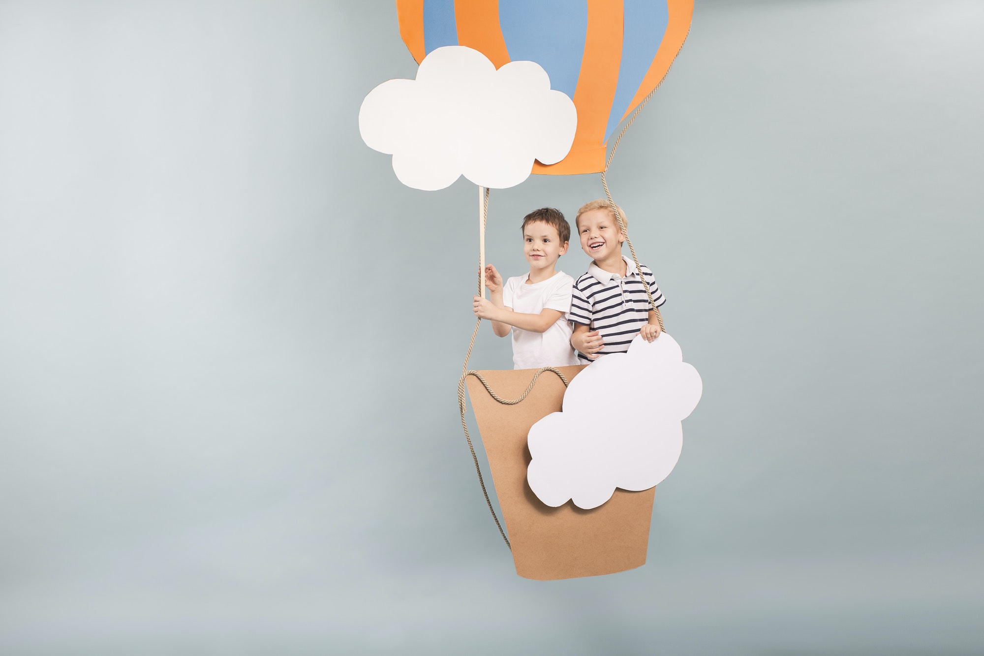 Boys flying in baloon